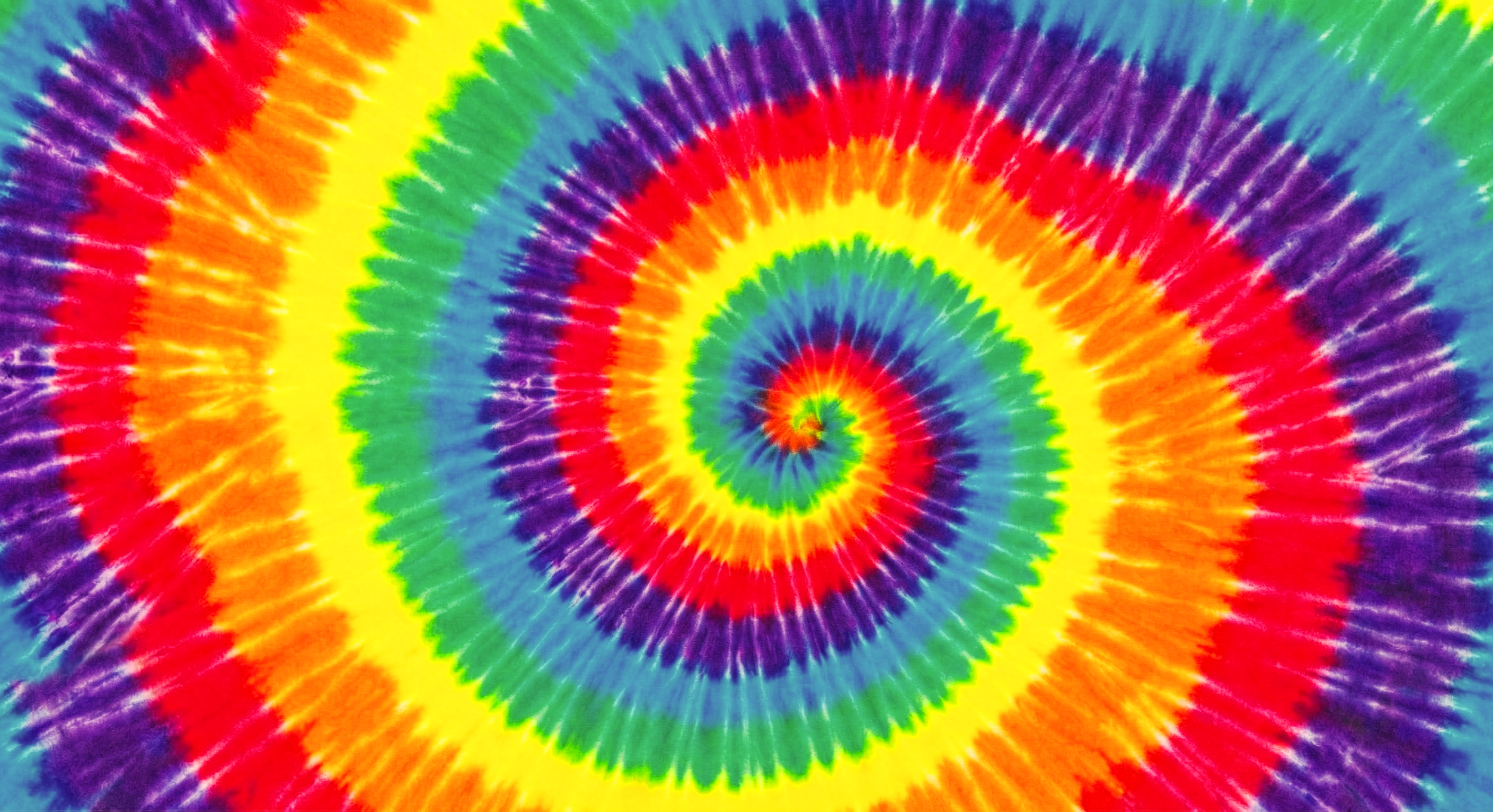 Colorful spiral tie-dye pattern with rainbow colors.