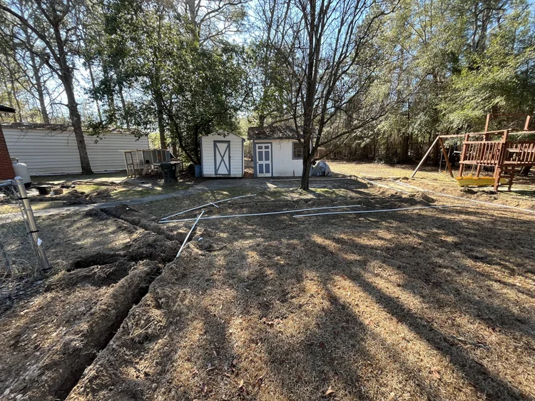 Lateral lines trenched through a yard