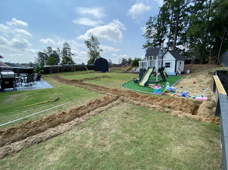 Trench layout across a backyard