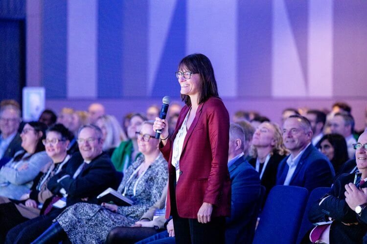 lady-in-the0crowd-speaking.jpg