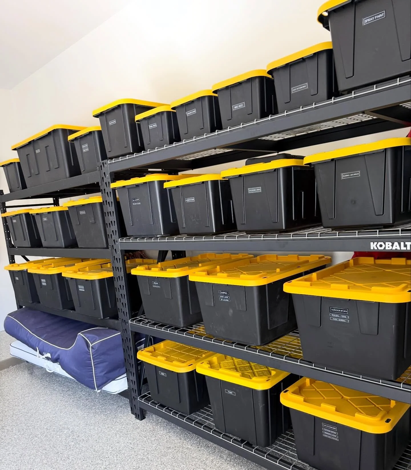 🏁 Garage glow-up complete! ✨

Black &amp; yellow bins? Checked. Kobalt shelving? Locked in. Floor space you can actually see? Priceless. 😤🙌 

This garage didn&rsquo;t clean itself &mdash; but it sure looks like it did. 👀
If Style is the answer&he