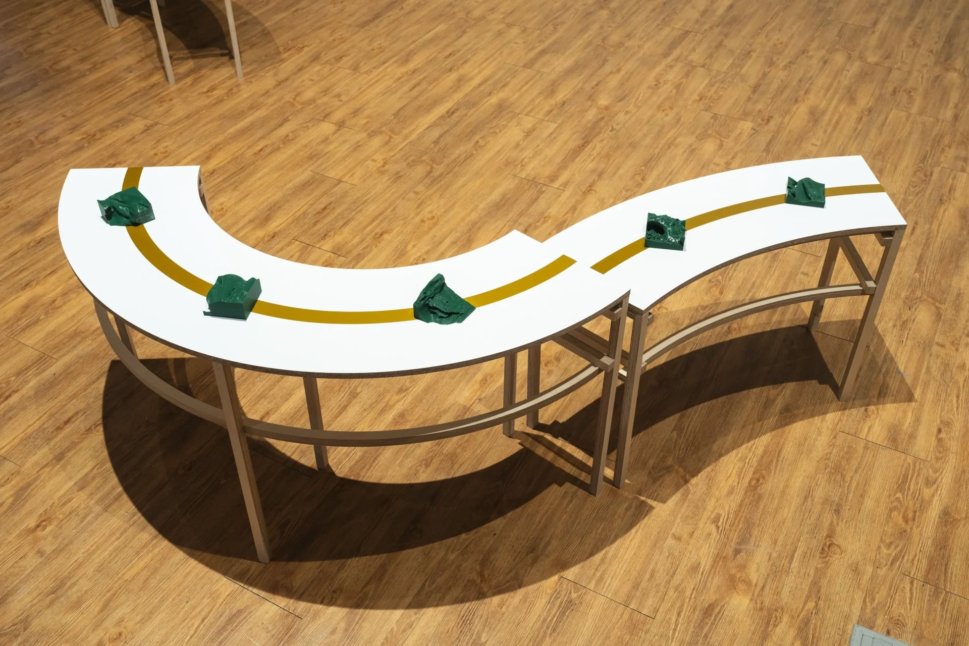 A closeup of the tables showing the layout of the 3D printed sculptures.