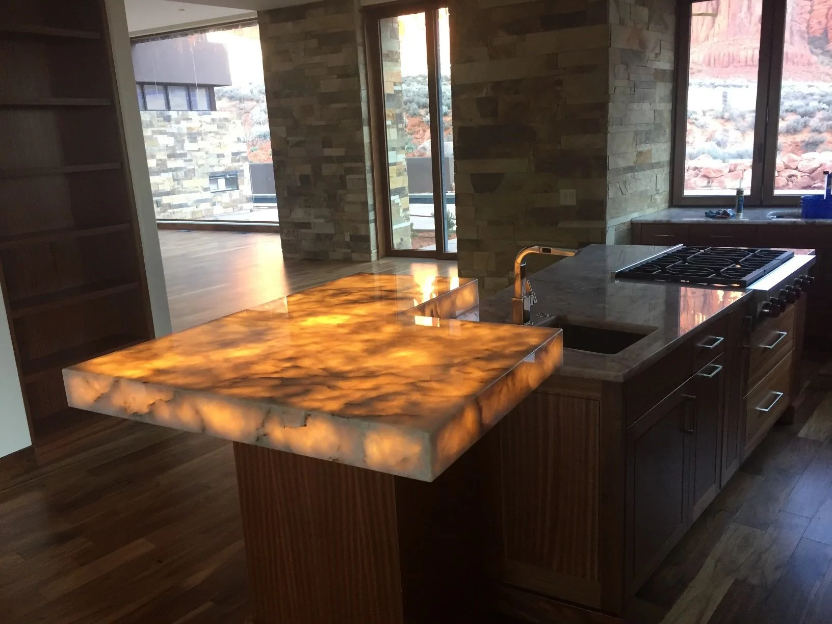 Kitchen with backlit granite countertop and mitered edges