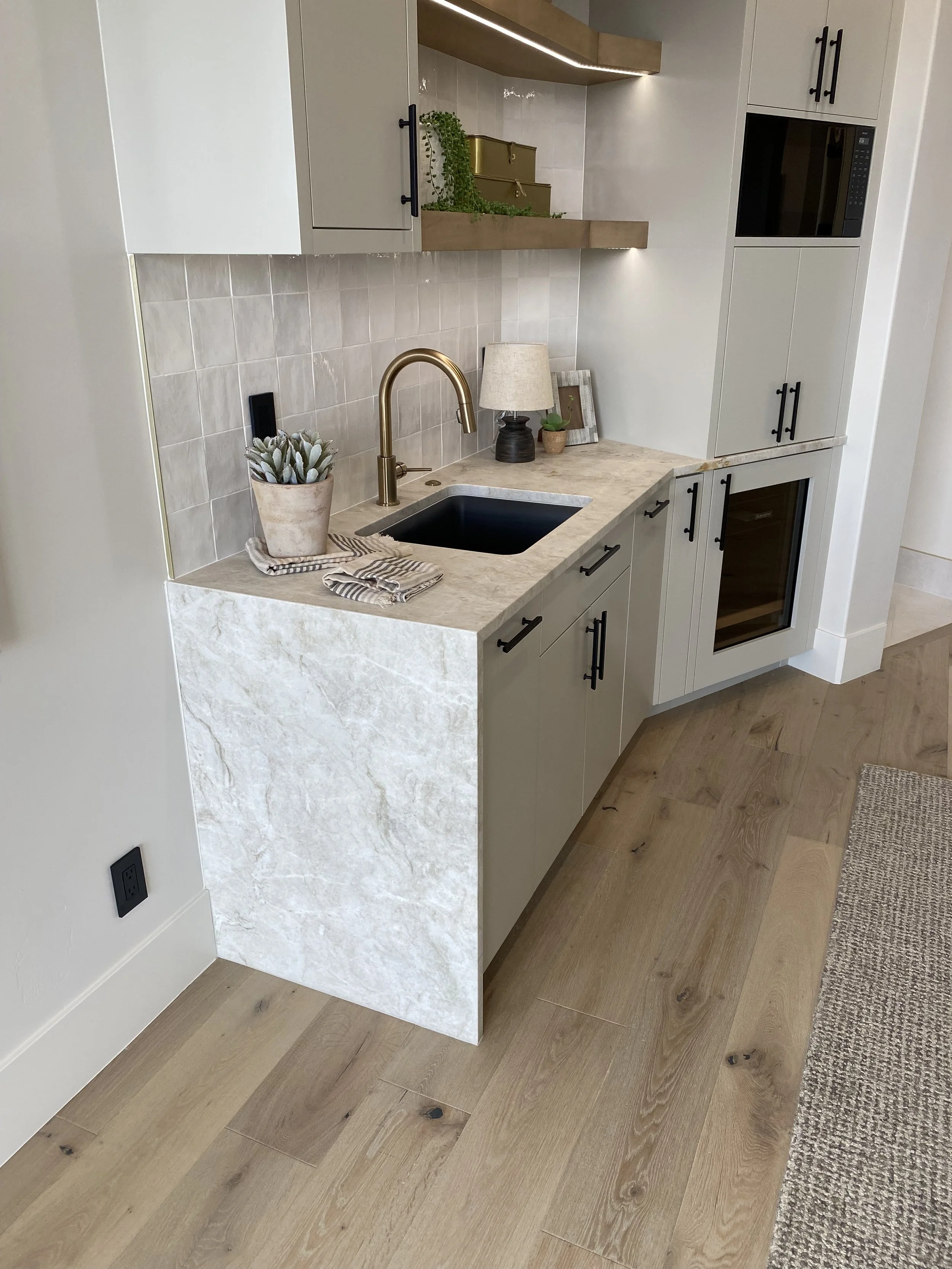 Casita kitchen with quartzite countertops and waterfall legs
