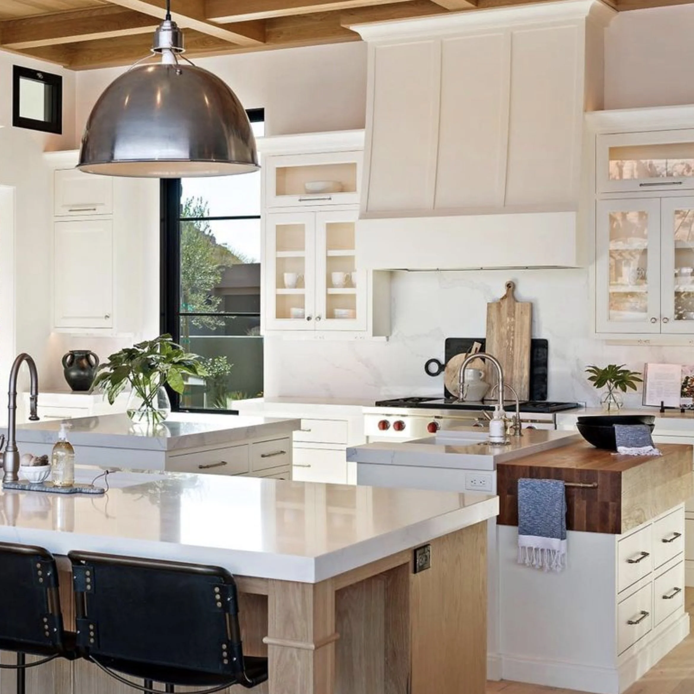 Kitchen with quartz countertops, mitered edges, and full height backsplash