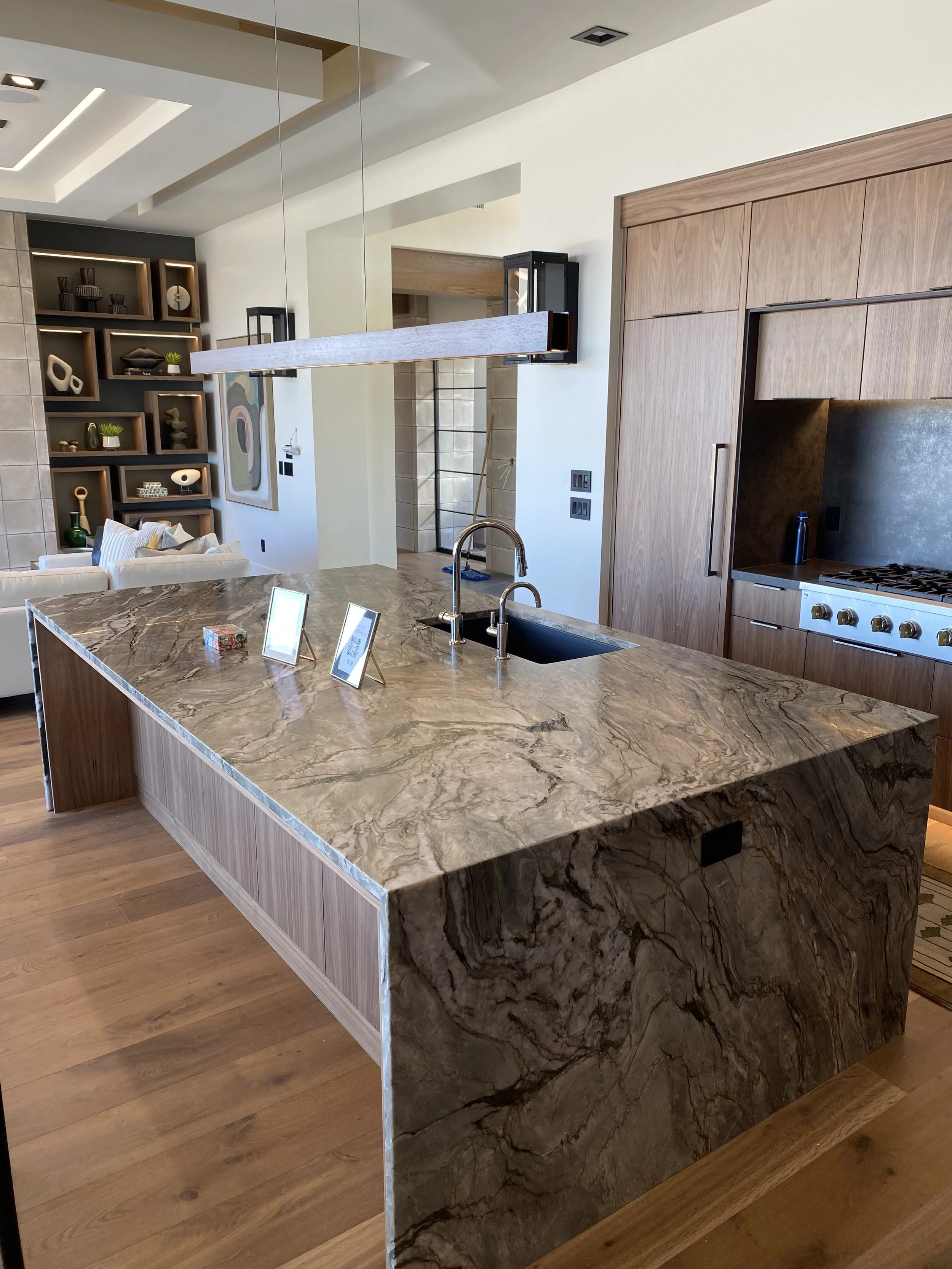 Kitchen with quartzite island, waterfall legs and neolith perimetric