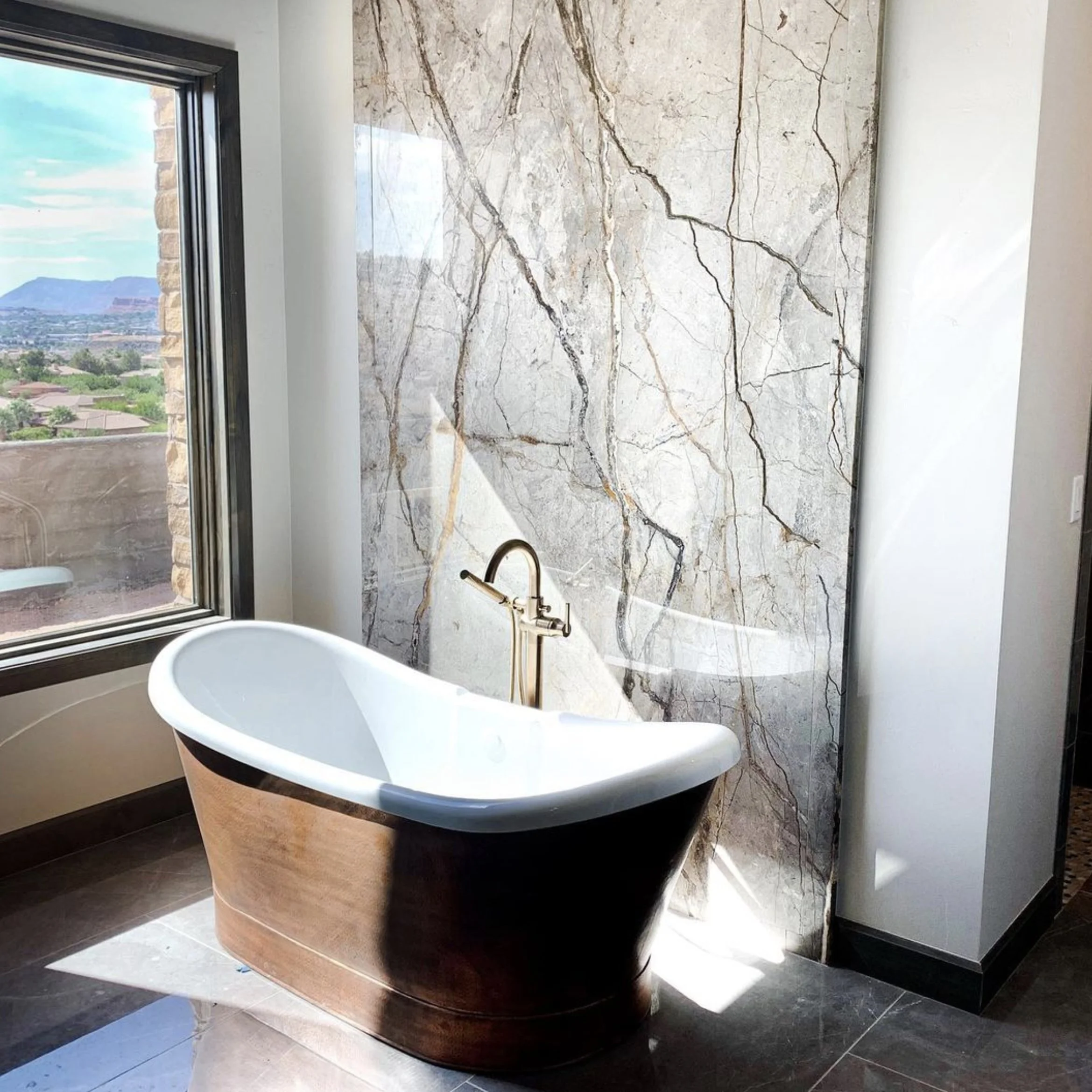 Renaissance Fabrication's free-standing tub with Granite Accent tub wall