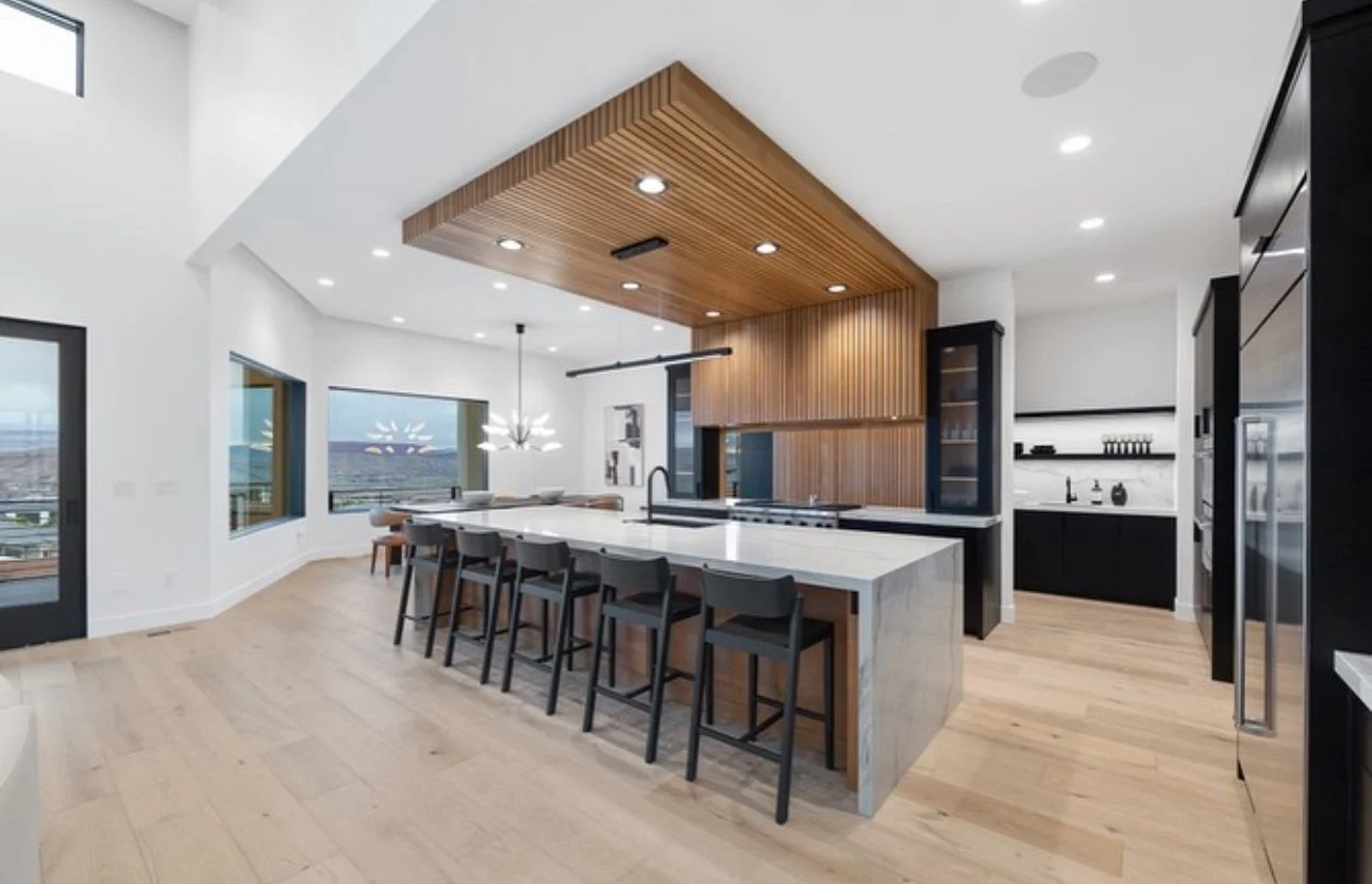 Kitchen with quartzite countertops and waterfall legs