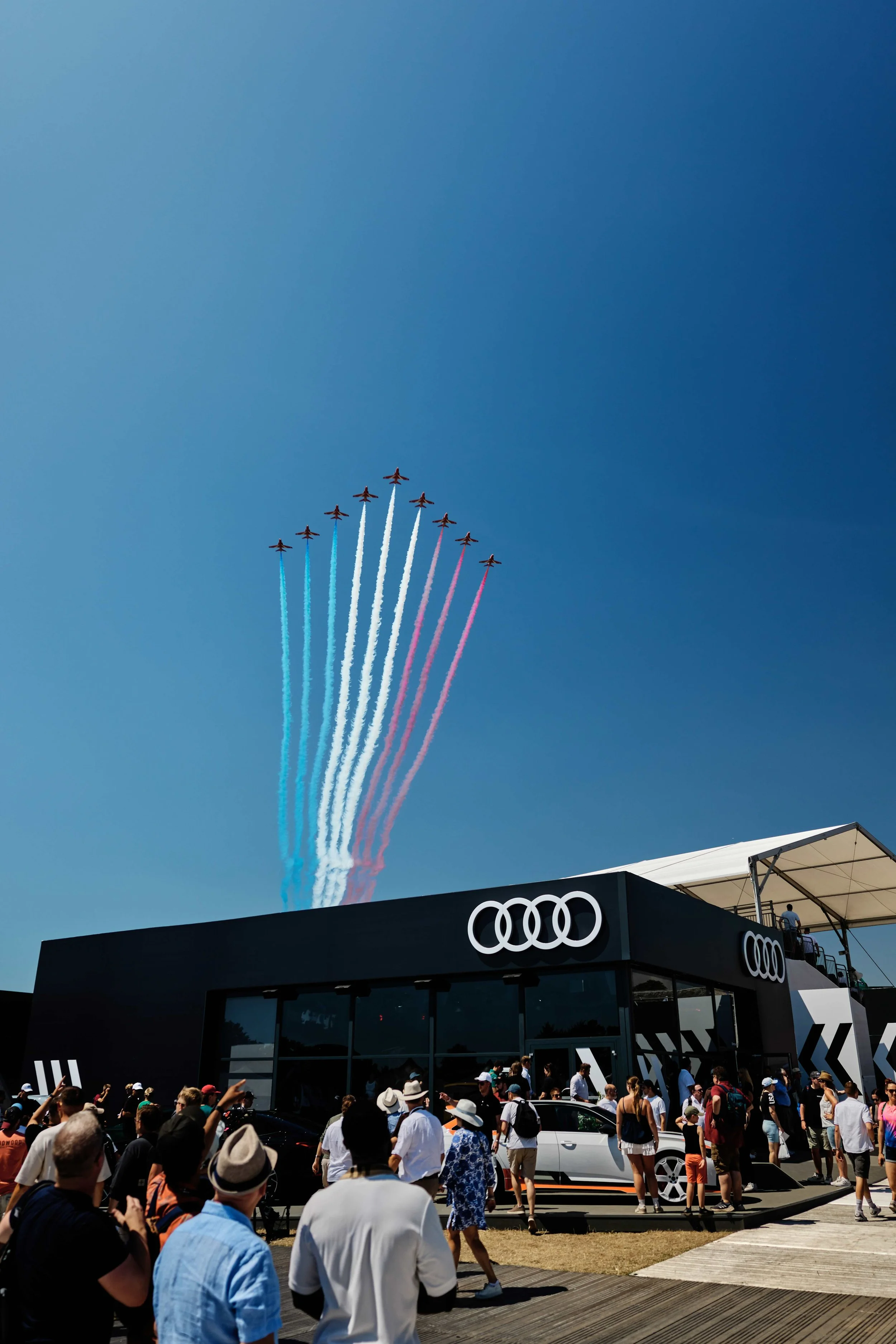 Red Arrows flying over the Audi booth at Goodwood Festival of Speed