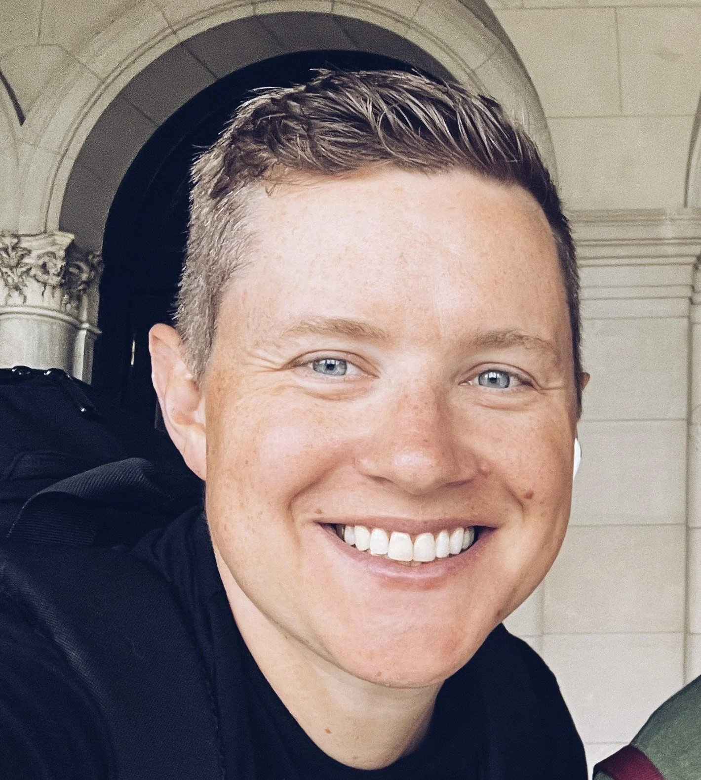 Photo of guy looking into camera and smiling