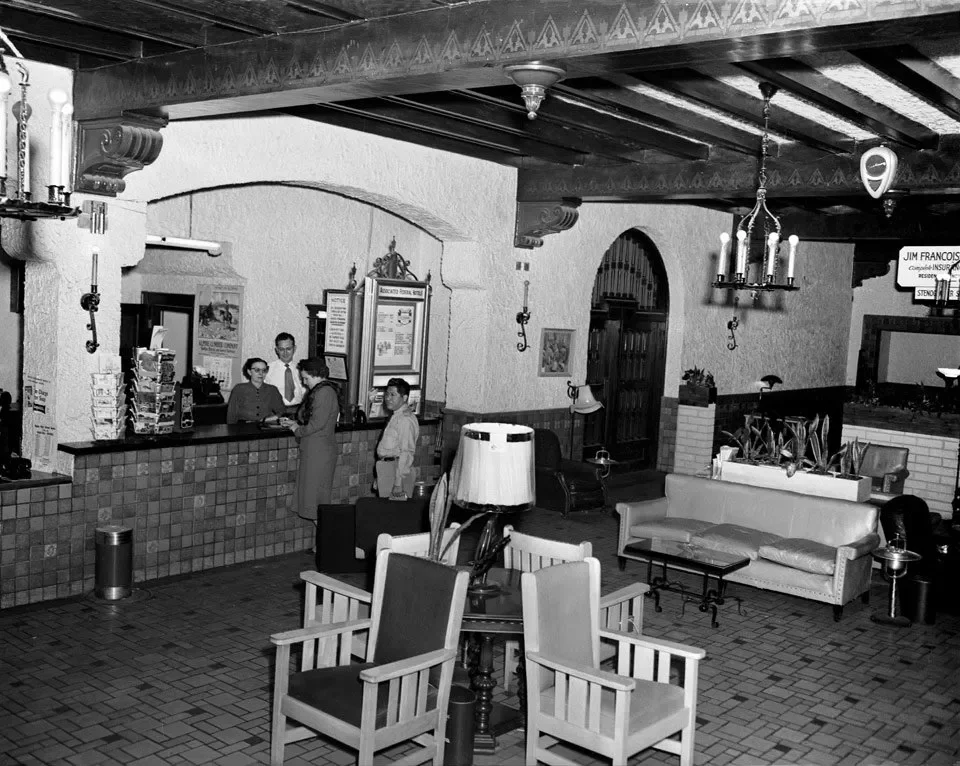 A historical black and white photo of the Grand Lobby and the lobby bar that used to be situation within Holland Hotel in Alpine, Texas.
