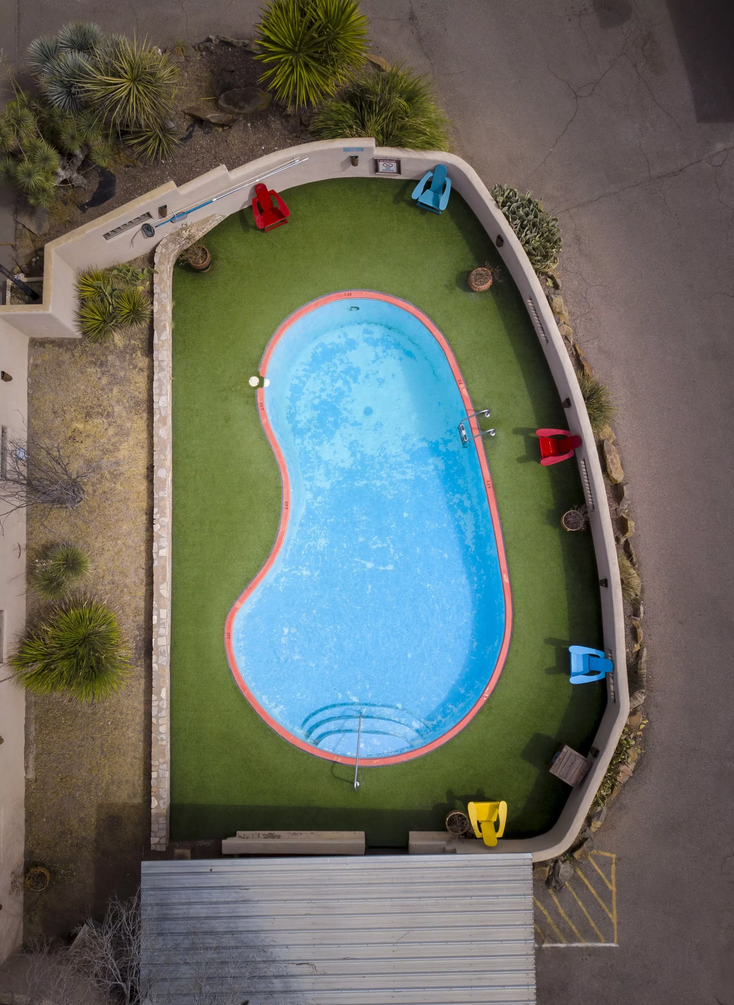 An aerial photograph of the beautiful pool at Maverick Inn located in the desert oasis of Alpine, Texas.