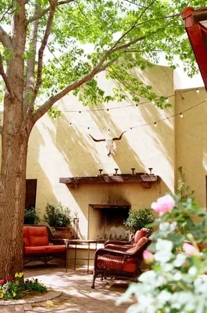 The Courtyard at Holland Hotel in Alpine, Texas has patio furniture, trees, and landscaping that provides the perfect venue for weddings, receptions, happy hours, or any other event or gathering.