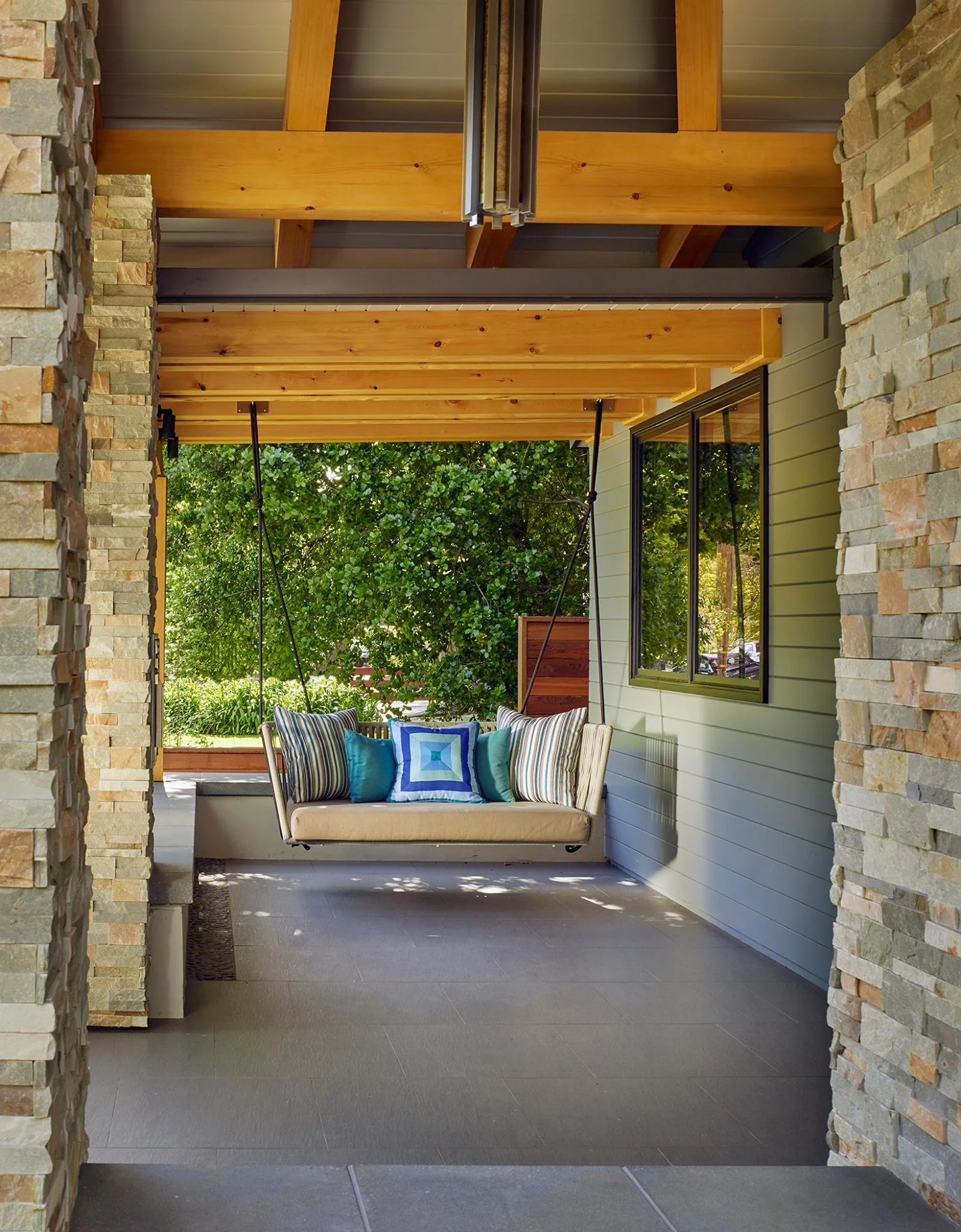 Contemporary custom home in Mountain View featuring expansive glazing, indoor-outdoor living spaces, and a sunken pool integrated into the landscape.