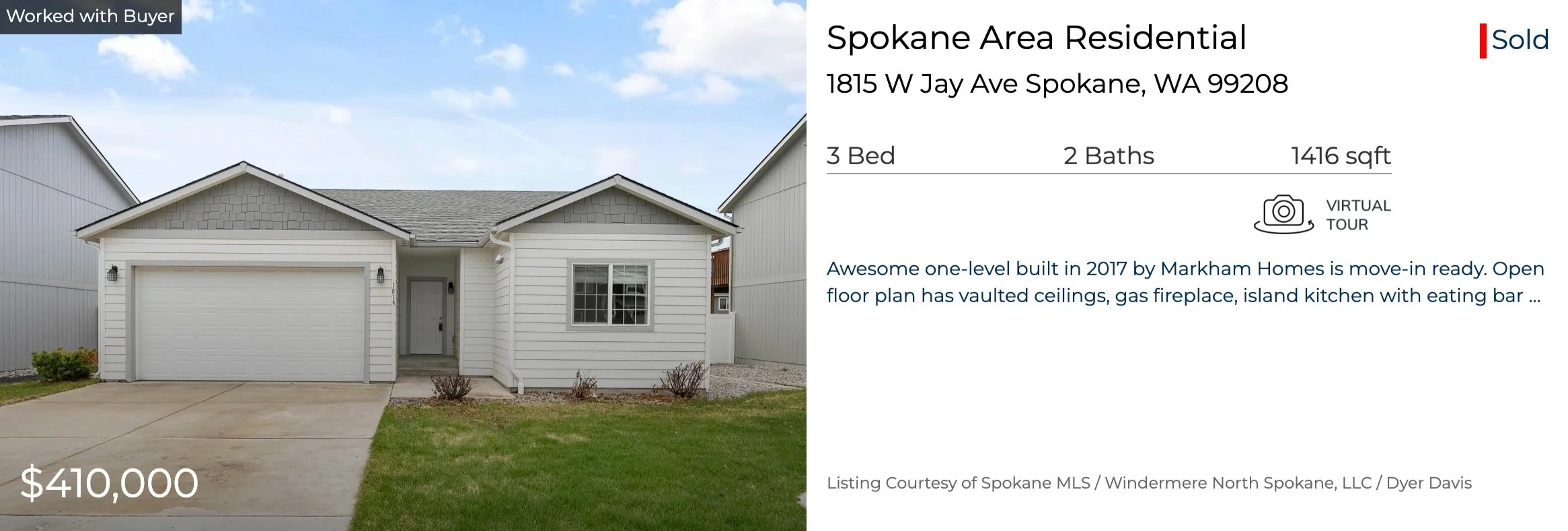 Front view of a white, single-story house with a two-car garage, situated on a small lawn with a concrete driveway, in Spokane, Washington.