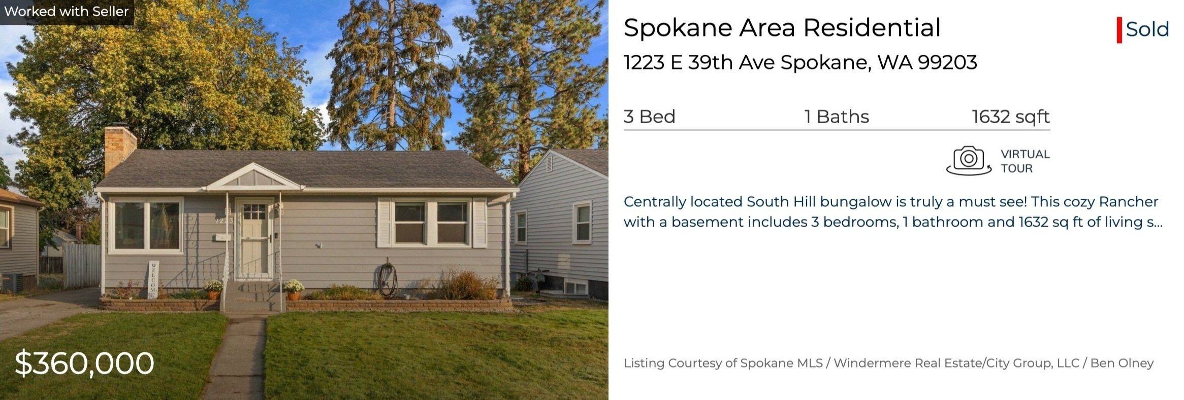 A single-story house with beige siding, white trim, and a gray roof. There is a small front porch with a white door, and a lawn with a walkway leading to the street. The background has tall trees and neighboring houses. The image is part of a real es