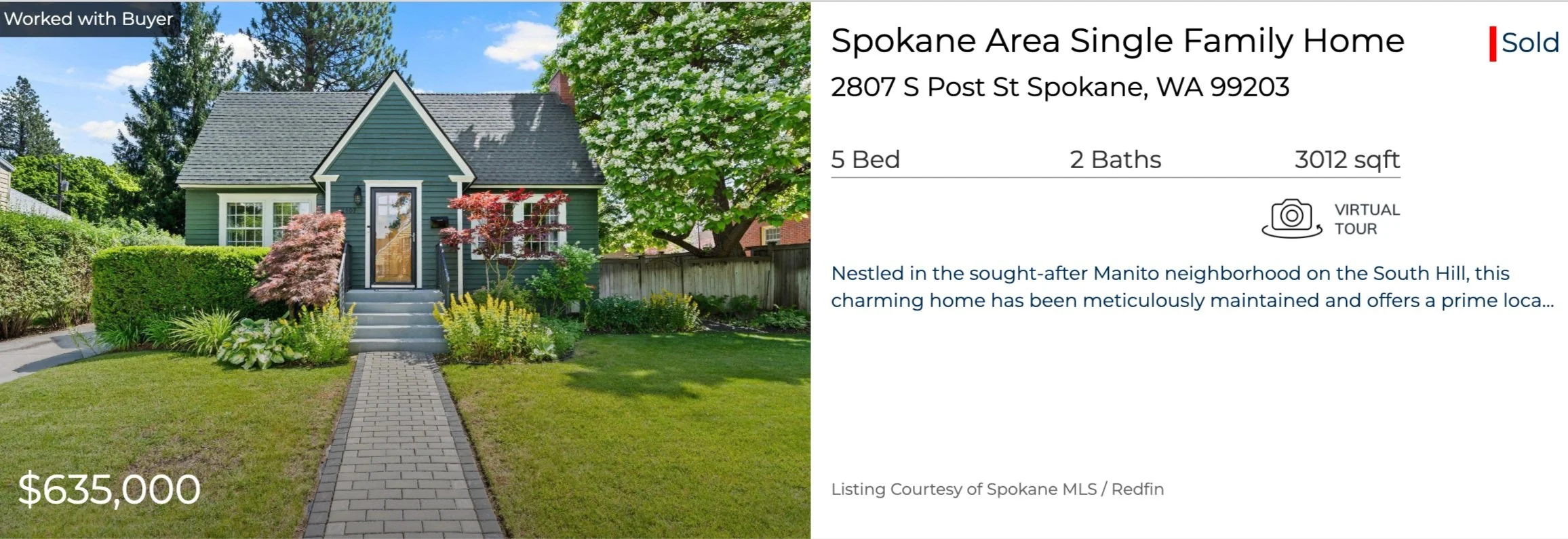 Front view of a green single-family home with white trim, a small front porch with stairs, surrounded by a manicured lawn, bushes, and trees in a suburban neighborhood.