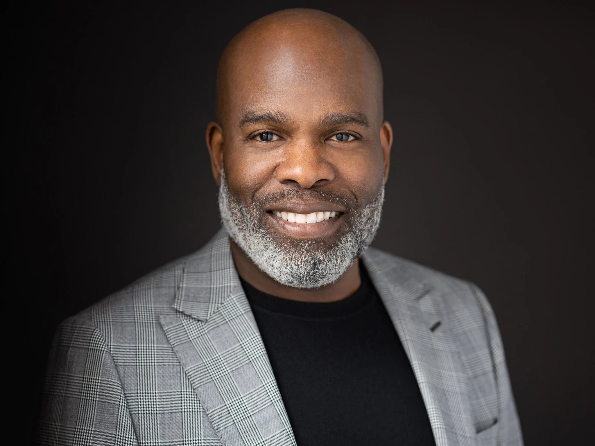Marcel A. Marcellin, Chief Executive Officer at Drake Law, Personal and Family Law Firm - A professional headshot of Marcel in a suit and tie, smiling confidently.
