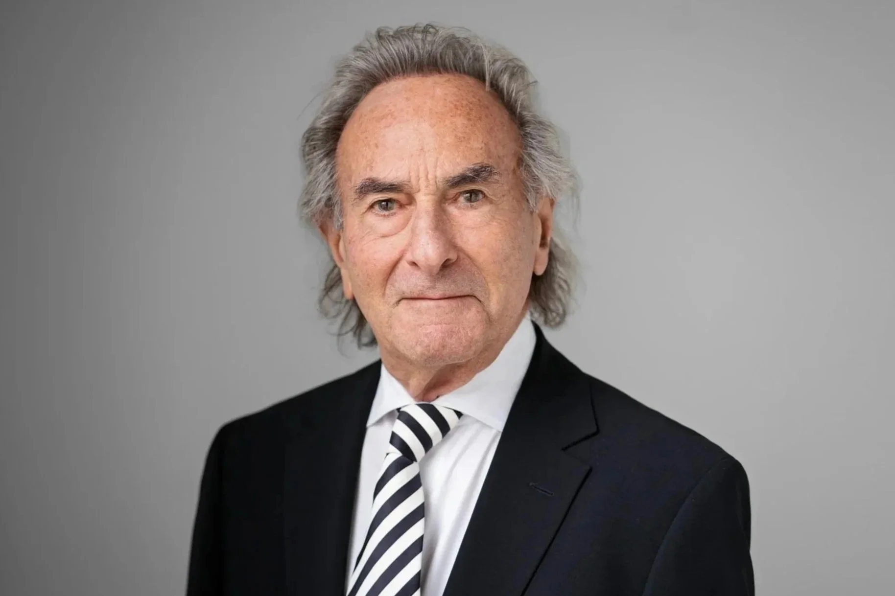 Paul M. Siskind, Senior Counsel - A professional headshot photo of Paul in a suit and tie.