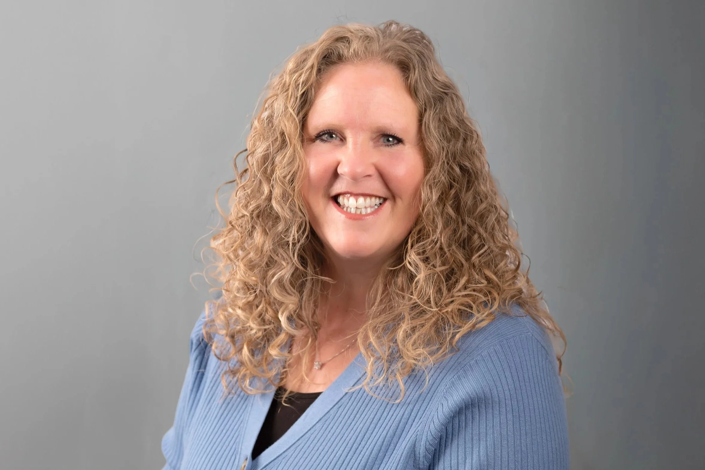 A professional headshot photo of Kelly Conroy, Family Law Clerk at Drake Law Family Lawyers in Sarnia, Ontario, smiling.