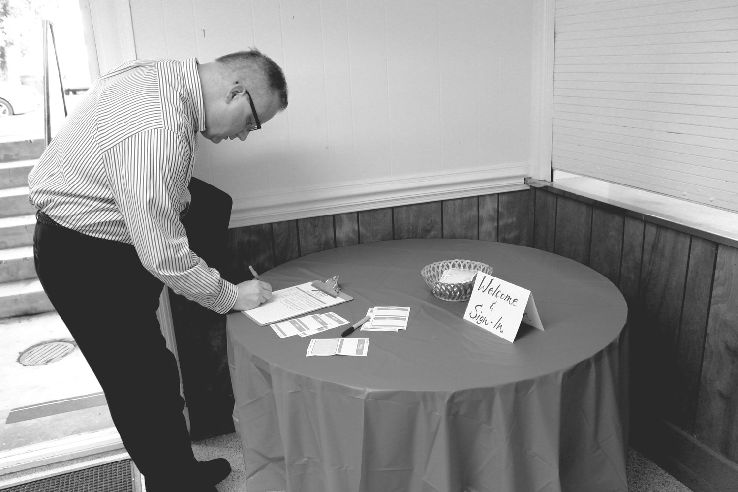 Rev. Alan Felton of Resurrection UMC checking in and preparing for the morning's discussion on faith, business, and hiring