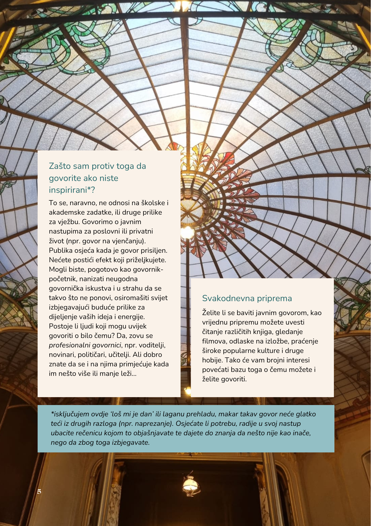 Interior view of a stained glass ceiling with a central floral design in warm colors, surrounded by geometric patterns in green, yellow, and blue.