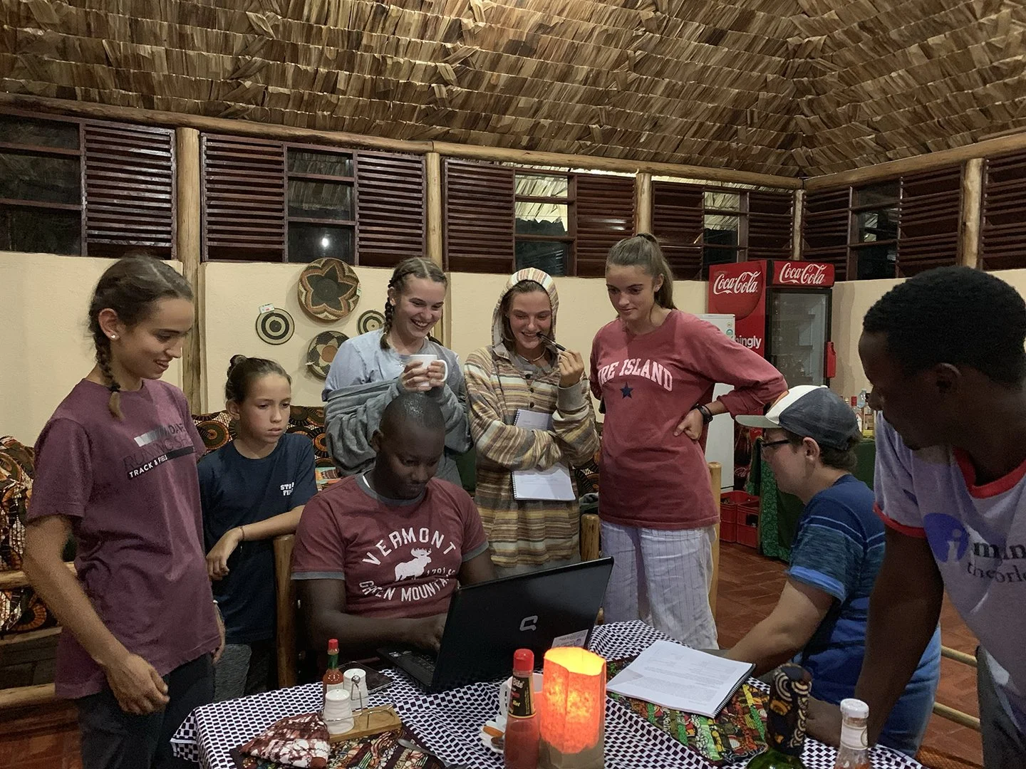 Asiimwe Allan shows students a new software tool