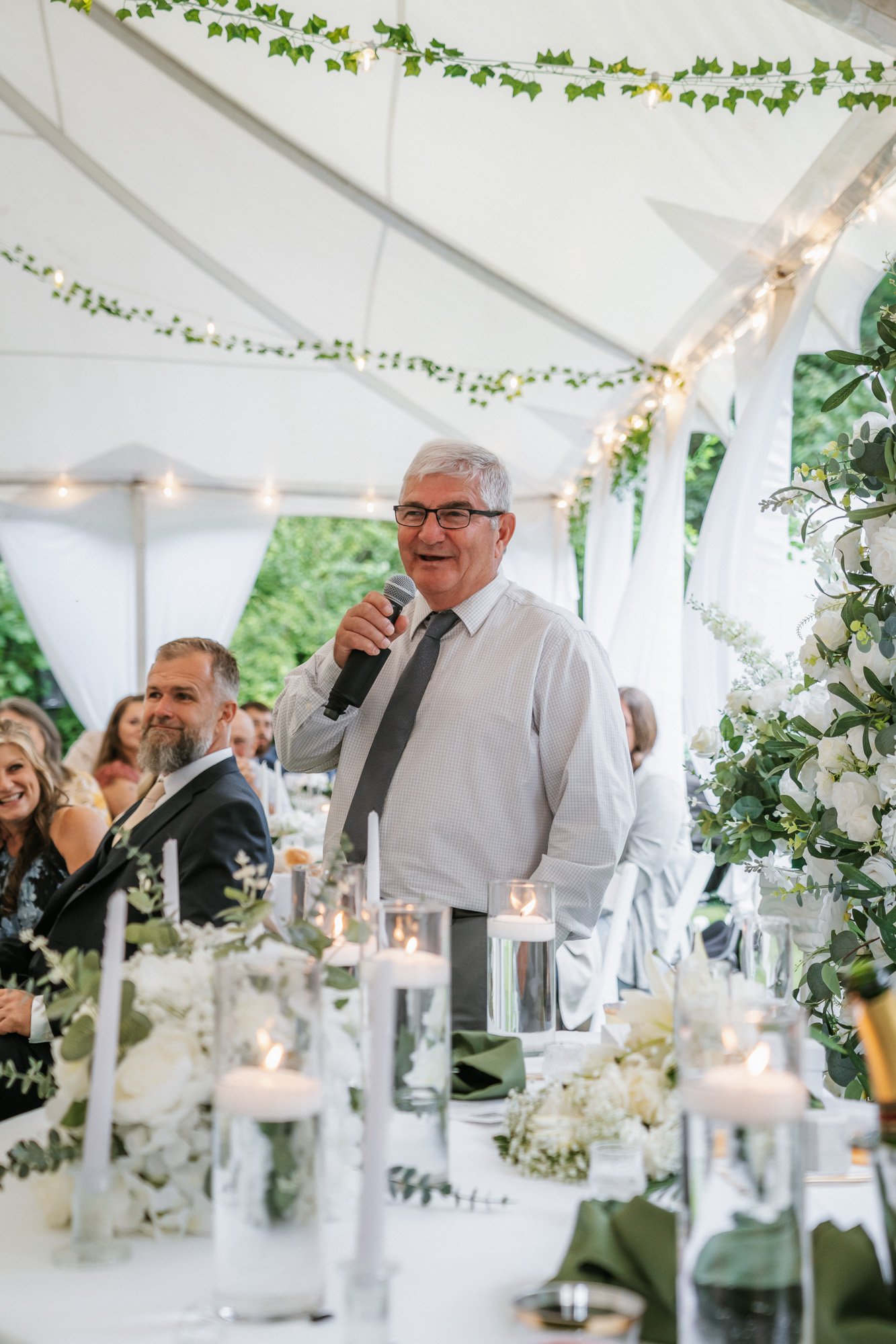 Bride and bridesmaids dancing with microphones at a wedding.