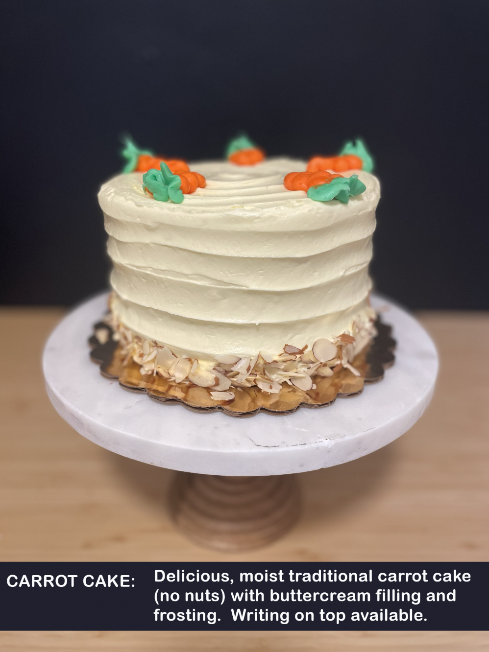 Delicious, moist traditional carrot cake (no nuts) with buttercream filling and frosting.  Writing on top available.
