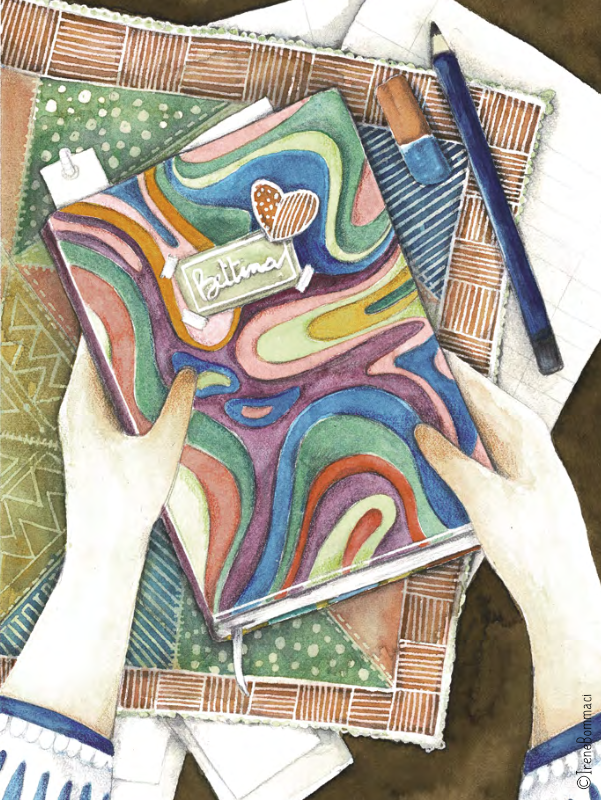 Persona che tiene in mano un quaderno con copertina colorata, con il titolo 'Botanical', sopra un tavolo con vari materiali di cancelleria e tessuti.