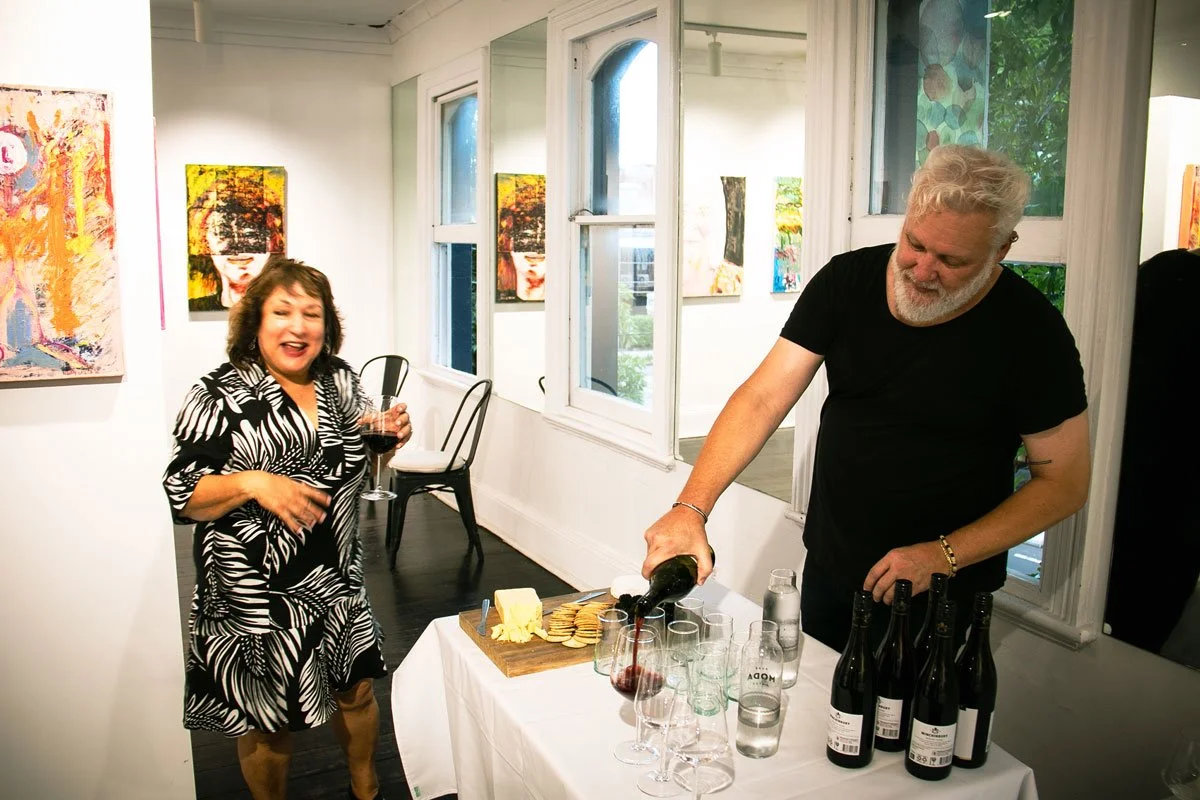 Mark-pouring-wine-&-Wendy-C.jpg