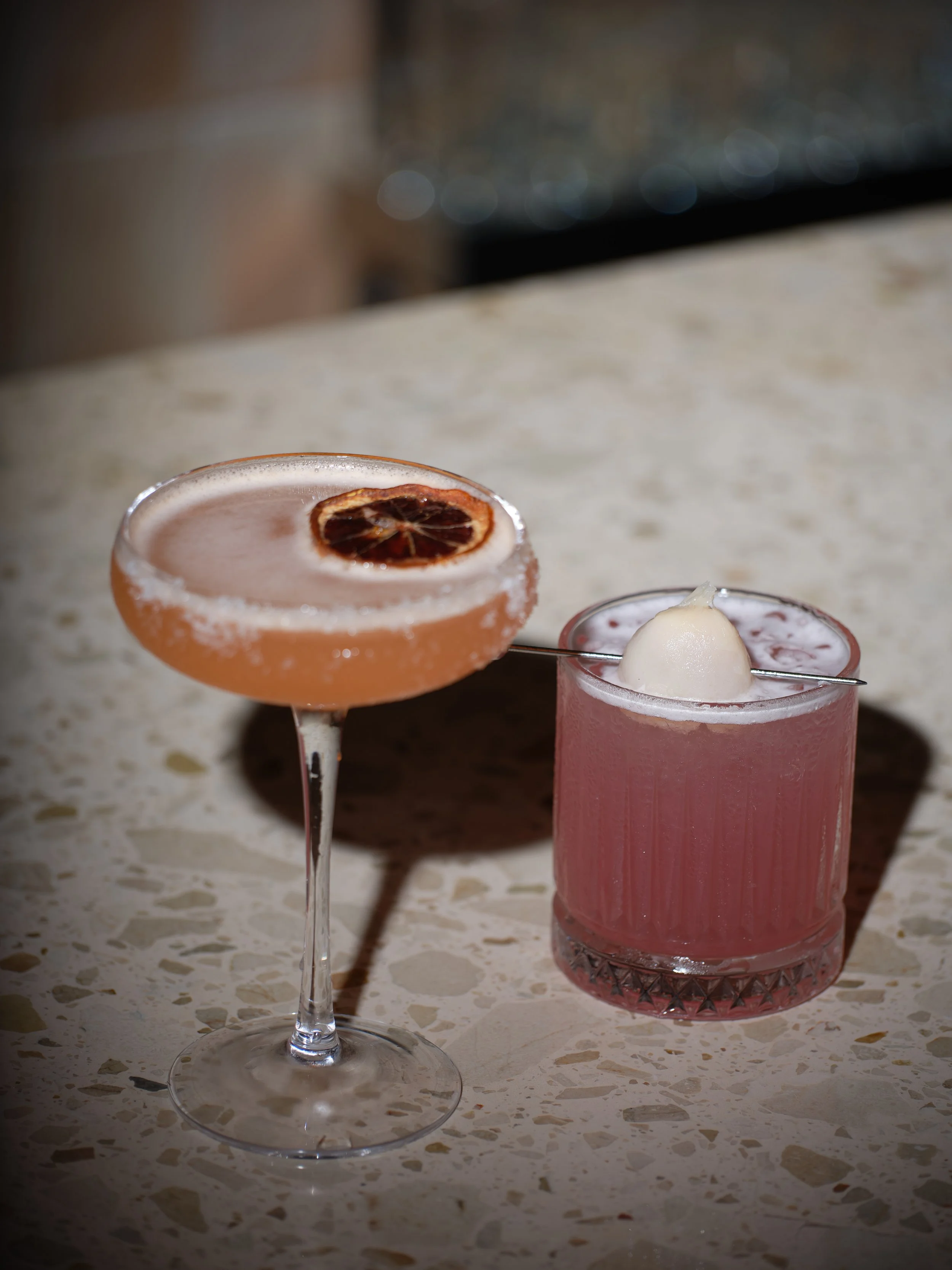 A martini cocktail with olives