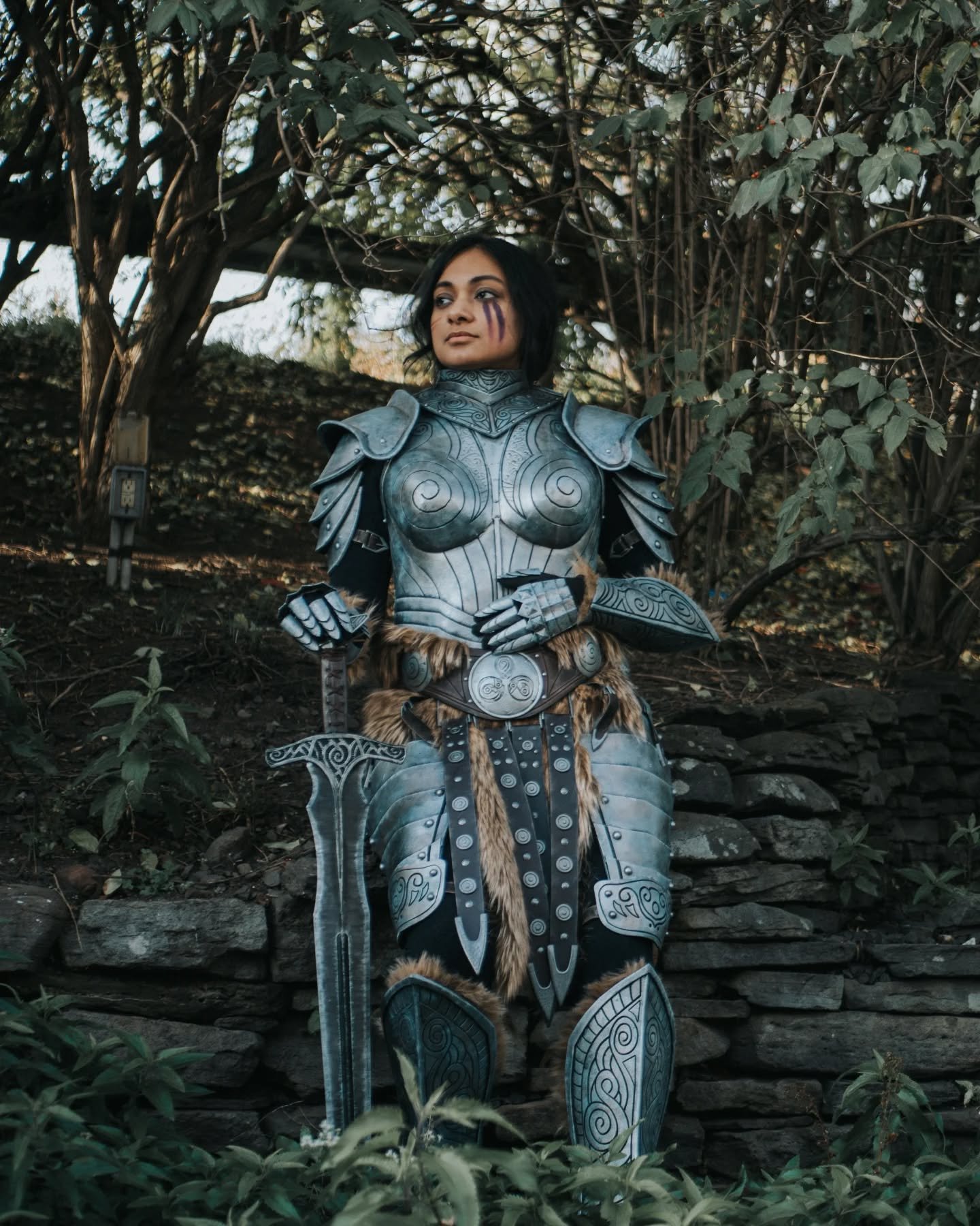 Early photos from @animenj_official of my Steel Plate Armor Skyrim cosplay! SWIPE FOR THE BACK! I did some sc*r makeup and w*r paint on my face for the final look. I didn't take home a win from the competition this time, but I will definitely continu