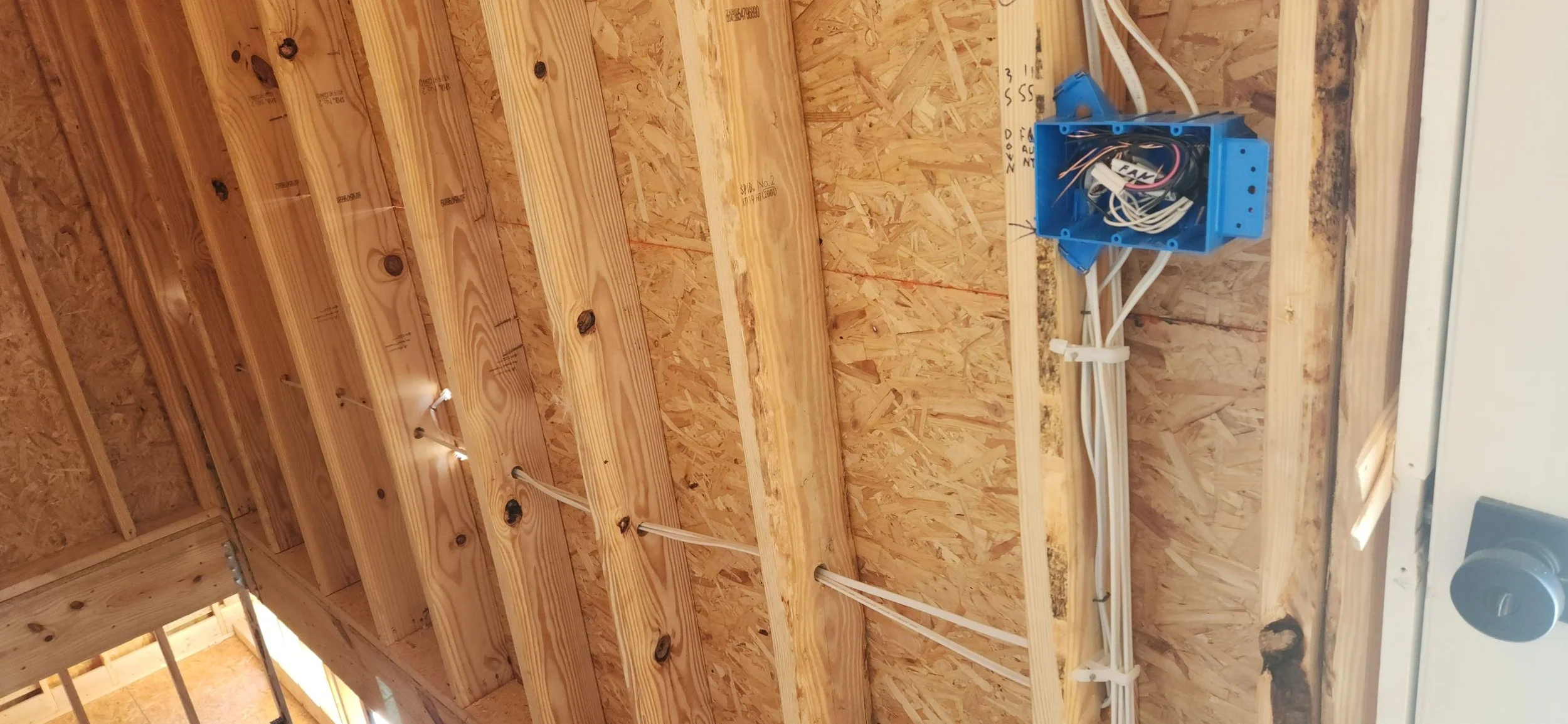 Deteriorated knob and tube wiring showing fire hazard risk