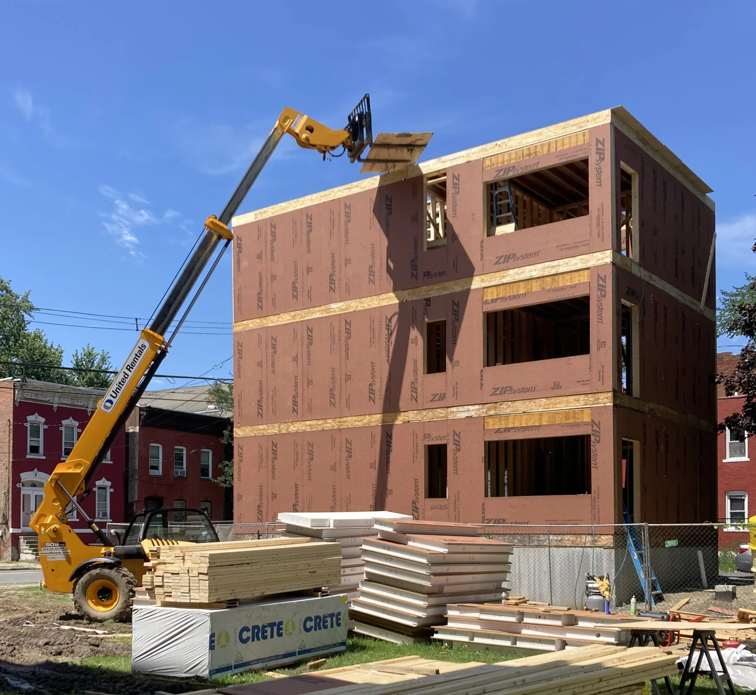 Panelized walls lifted into place, reducing on-site construction time.