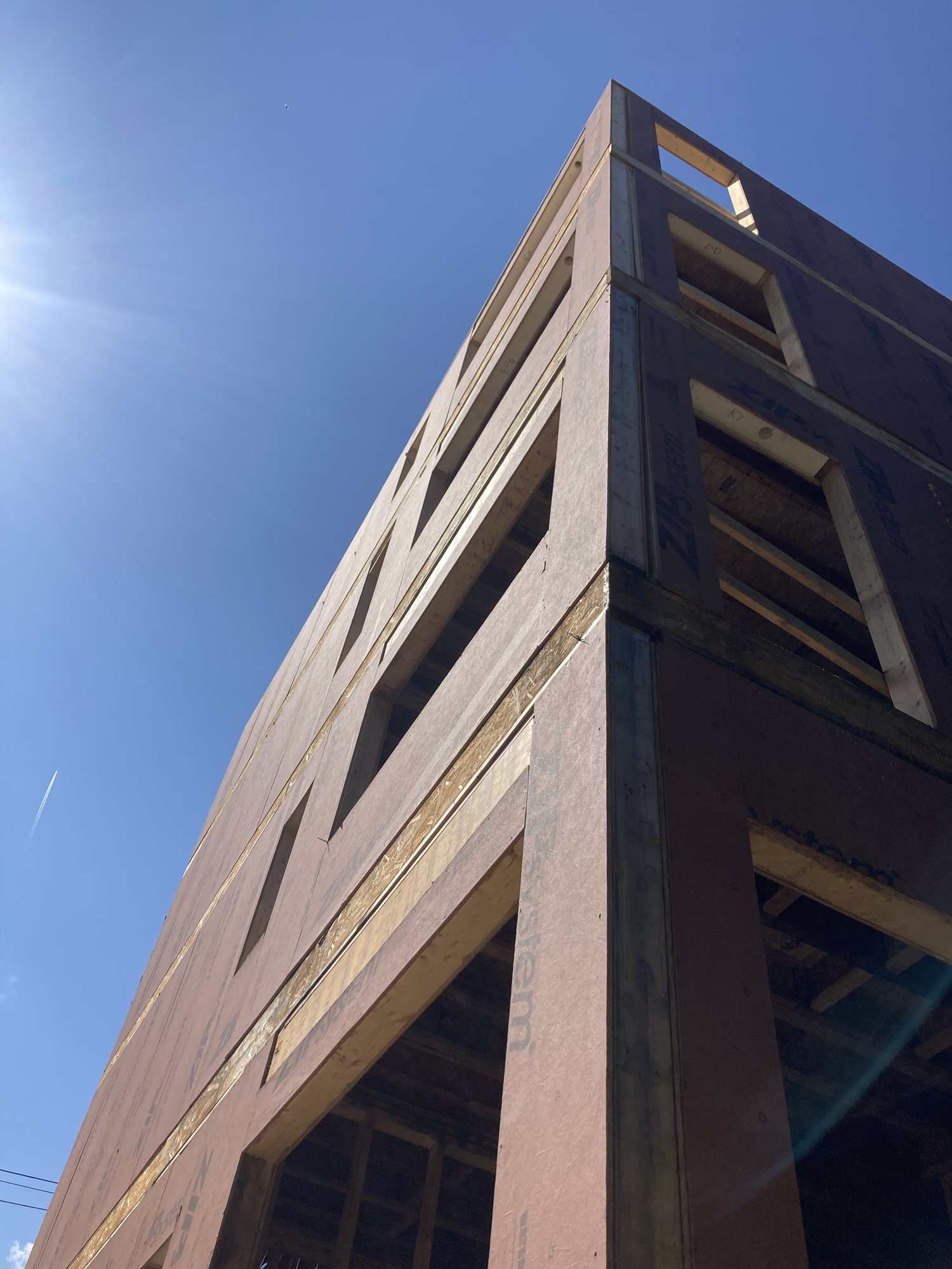 Exterior prefabricated panels assembled on-site with precision connections.