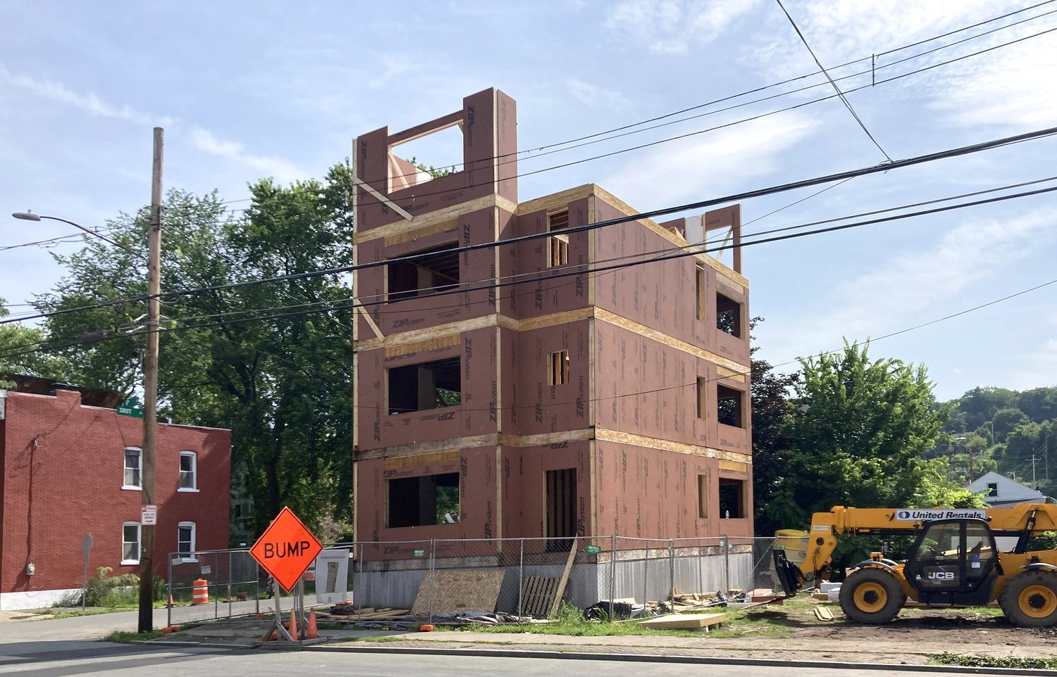 The four-unit Swift Street prototype under construction on a narrow Troy lot.