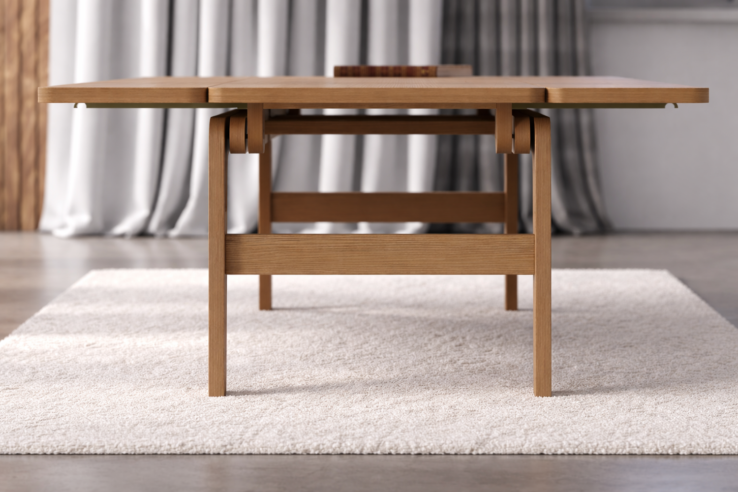 Folding Elevator dining table shown in its open configuration in light maple wood on a textured rug