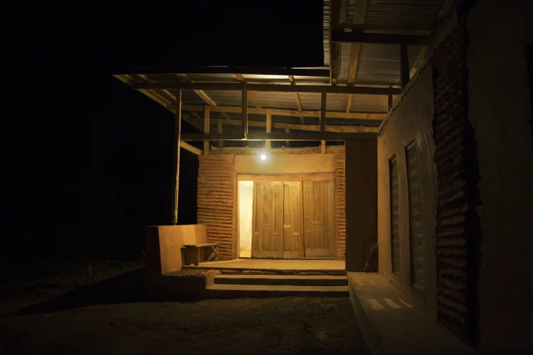 Mudhouse lit at night