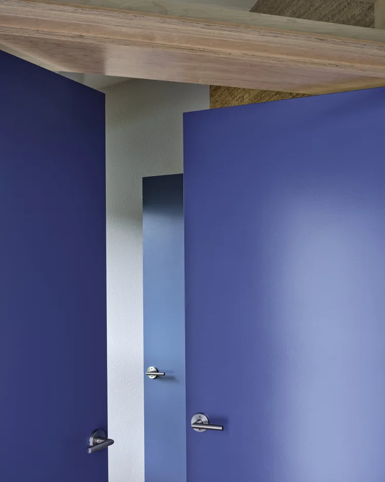 Blue doors under a cork ceiling