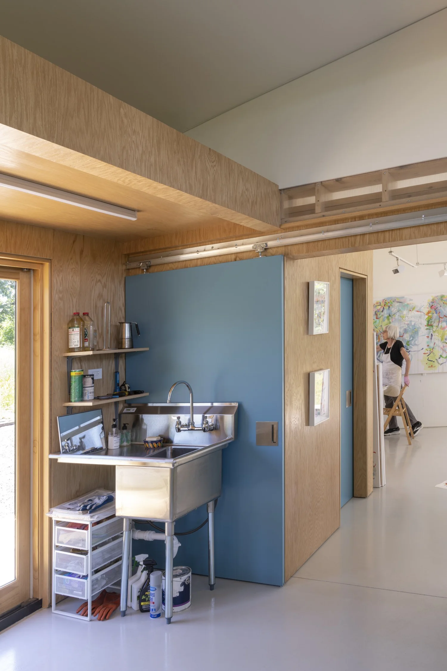 Hemp Art Studio, vestibule with sink and blue sliding door