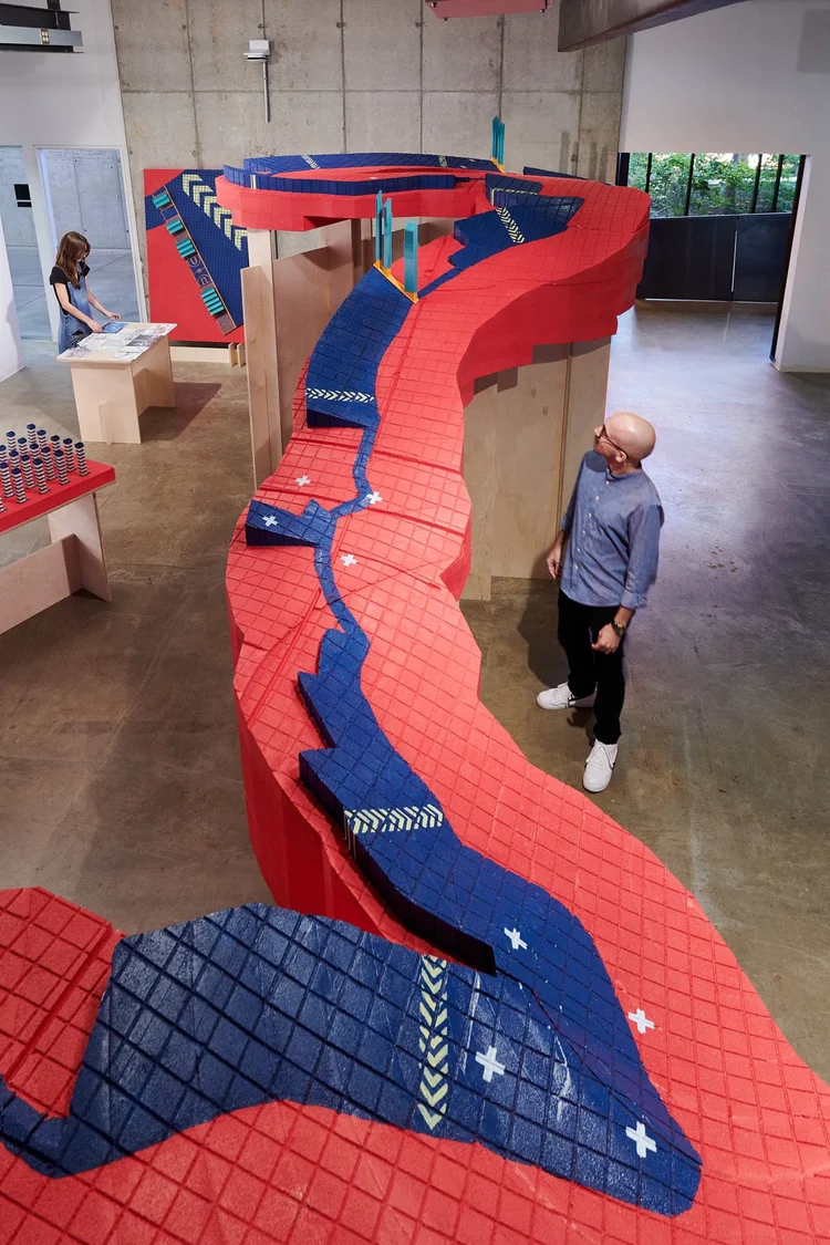 Red and blue floor installation in a gallery