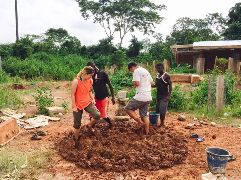 Mudhouse, mixing earth by foot