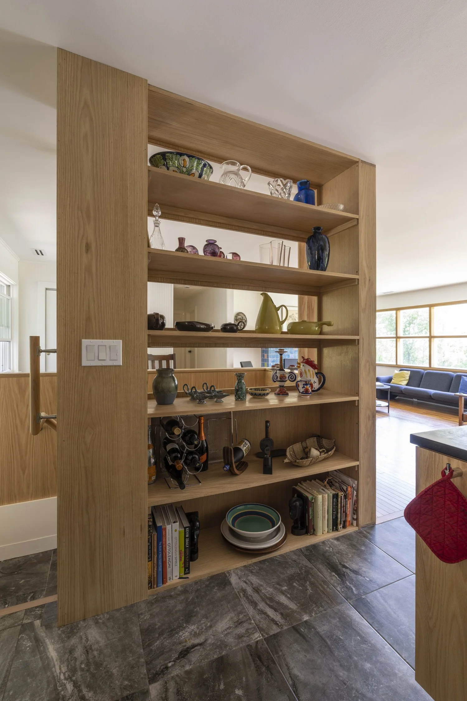 Drumlin House, plywood shelving between kitchen and living room