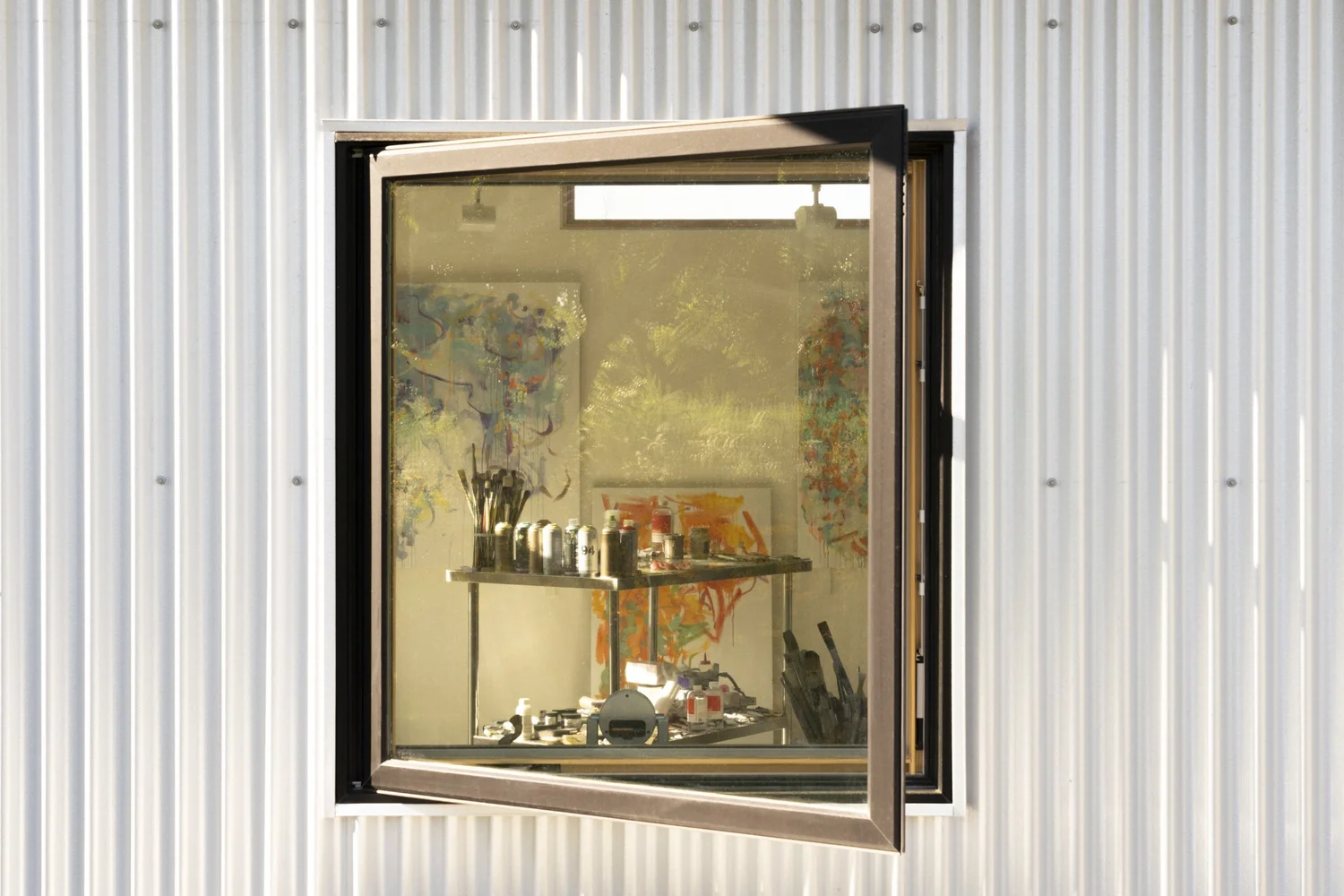 Hemp Art Studio, window open in the corrugated cladding