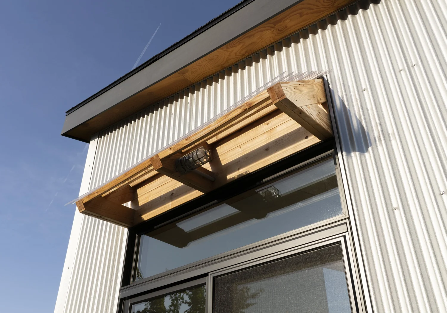Hemp Art Studio, wood awning over the glazed door