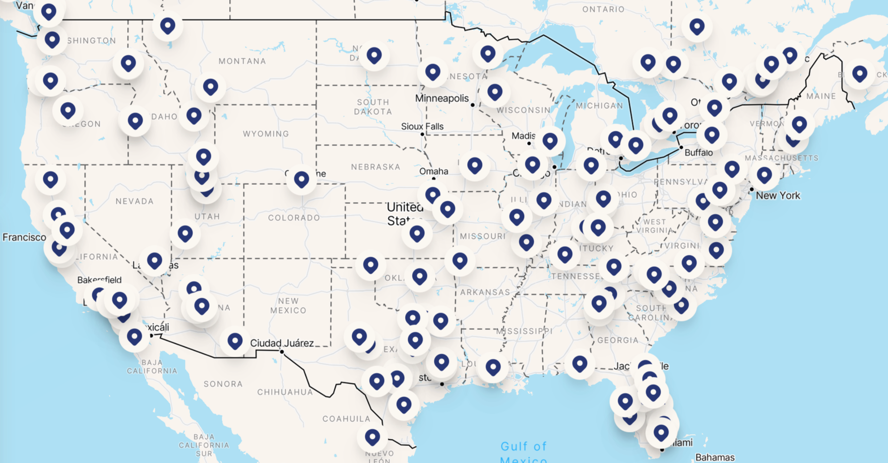 Map of the United States with blue location markers across various states.