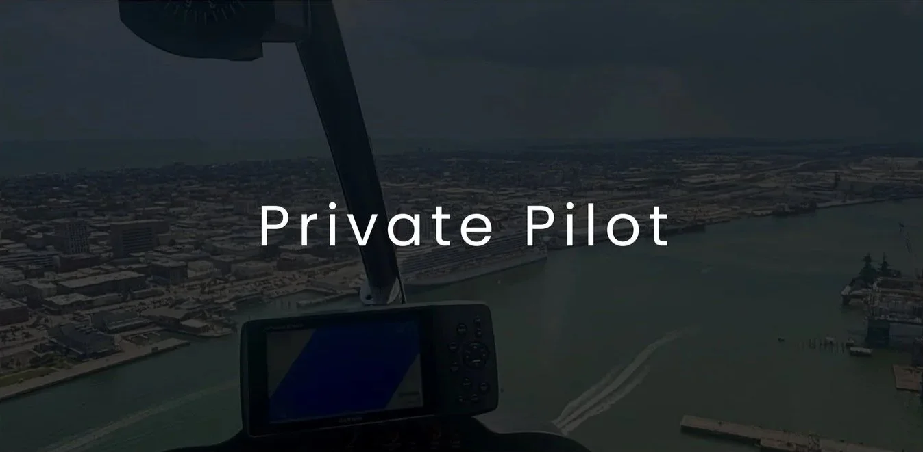 Aerial view from a helicopter cockpit showing a cityscape, river, and coastline with the text 'Private Pilot'