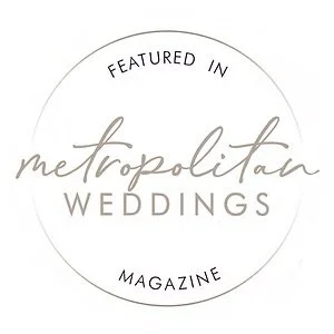 "Metropolitan Weddings Magazine" feature badge in a circular design