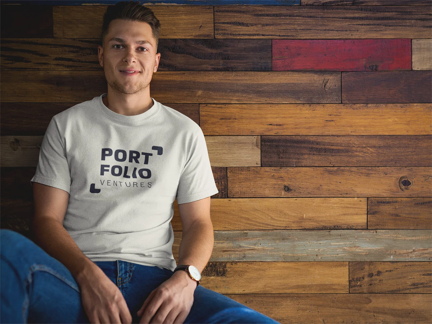 man-wearing-a-tshirt-mockup-while-sitting-against-a-wooden-wall-a17849.jpg
